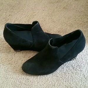 Black booties with gold heel